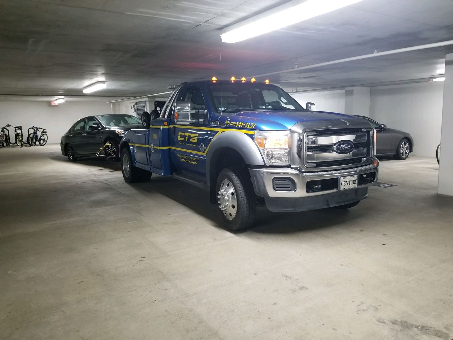 CTS self-loader removing a vehicle from a parking garage